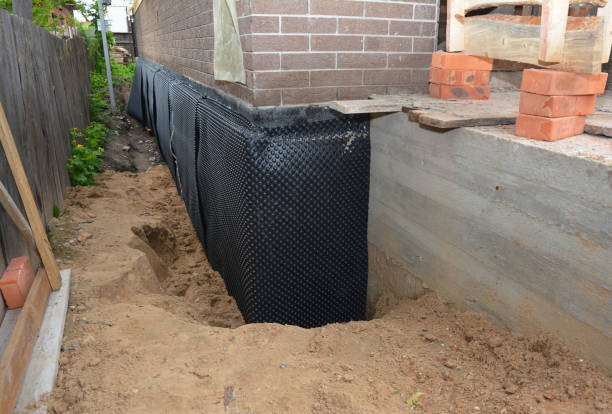 Happy homeowners after waterproofing job in Delta